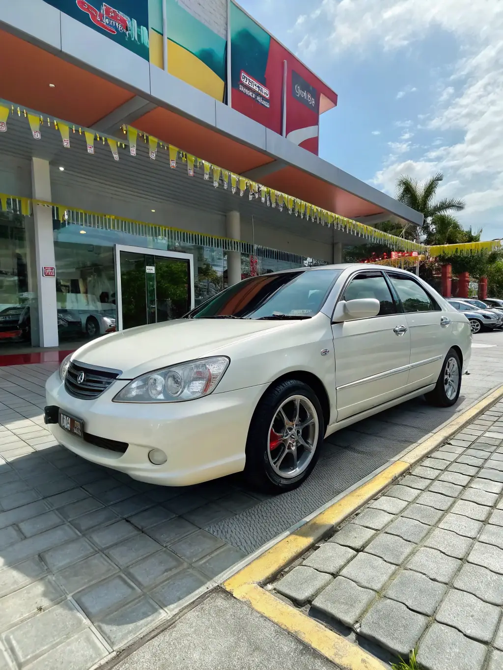 A visually appealing graphic of a car with eye-catching advertising graphics, representing Nothimporta's innovative marketing solutions for the motor industry.